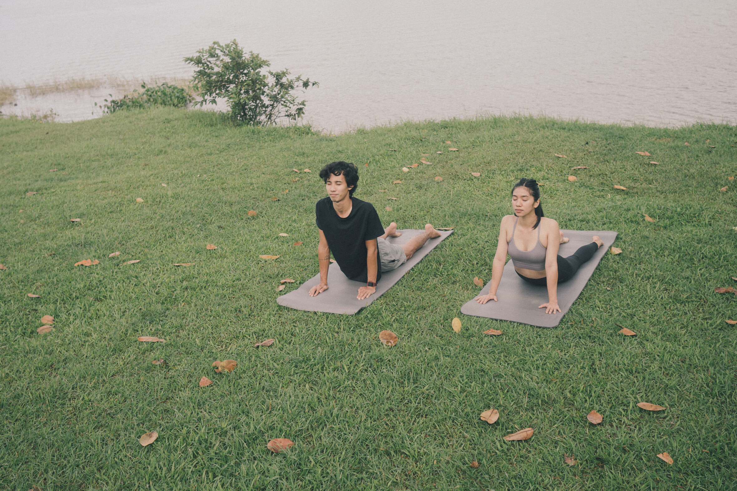 Couple Doing Yoga Outdoors